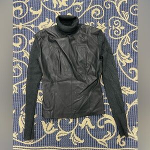 Posh turtleneck sweater with a leather front section.